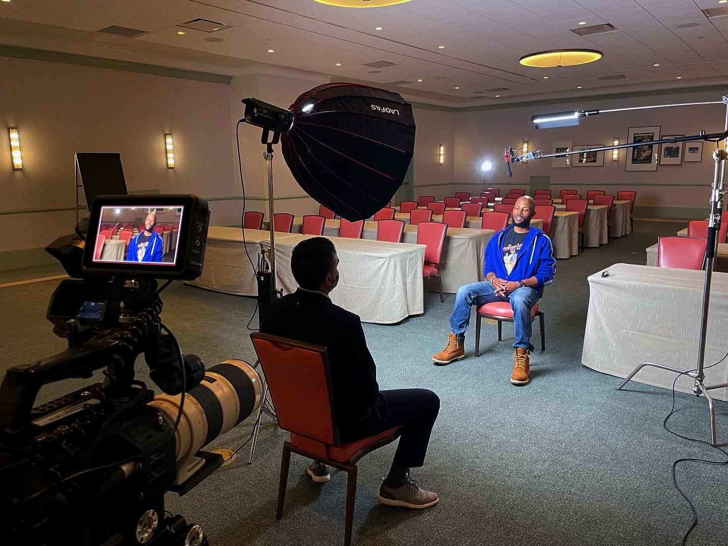 Professional conference video interview setup with lighting and camera crew in Las Vegas